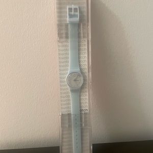 NIB SWATCH light blue silicone watch